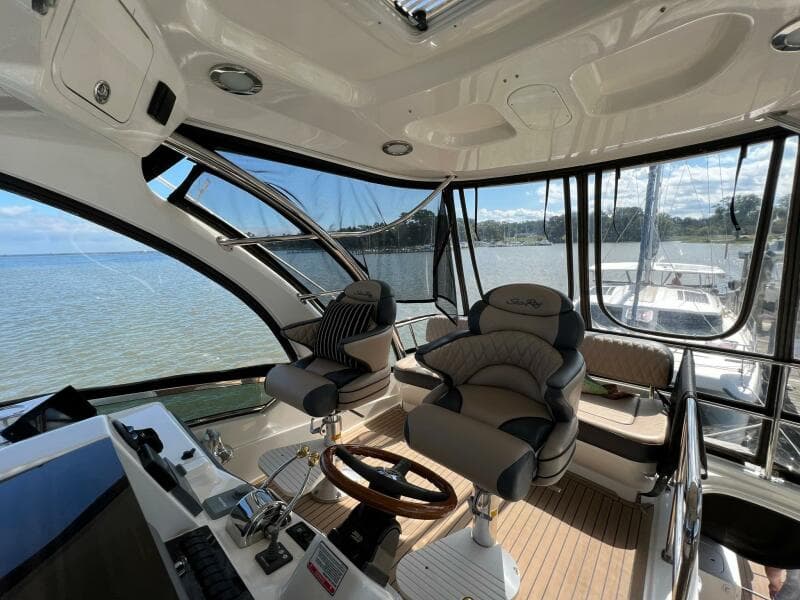 2005 Sea Ray 500 Sedan Bridge helm with luxurious seating and panoramic water views.
