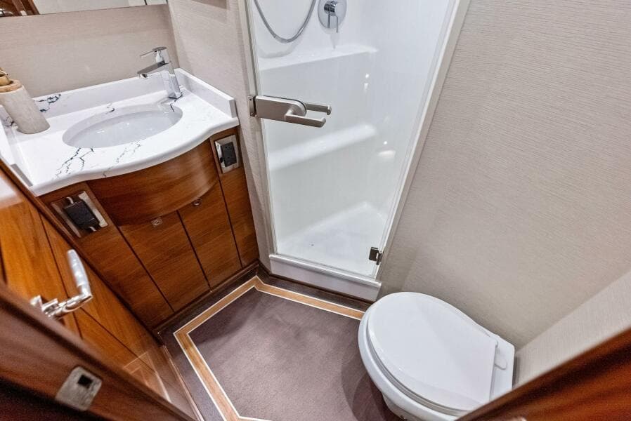 2023 Viking 64 Convertible- SIN PELO- Port Stateroom(s) Head