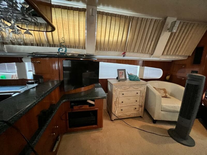 Interior of 2000 Carver 506 Motor Yacht with cozy seating and entertainment area.