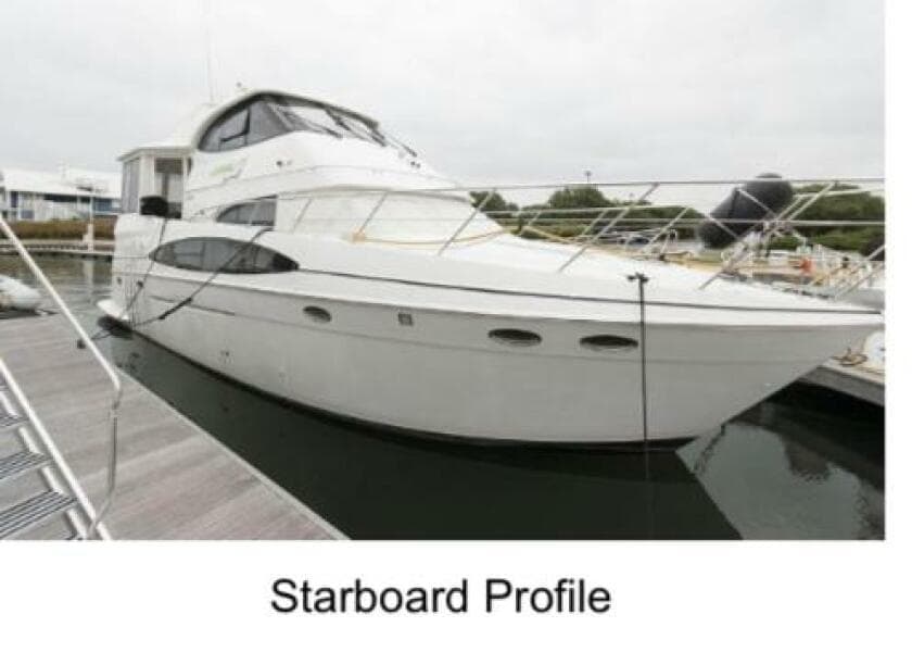 2000 Carver 506 Motor Yacht, starboard view, docked in marina.