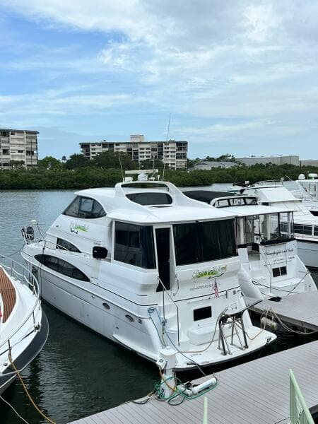 2000 Carver 506 Motor Yacht docked at marina with buildings in background.
