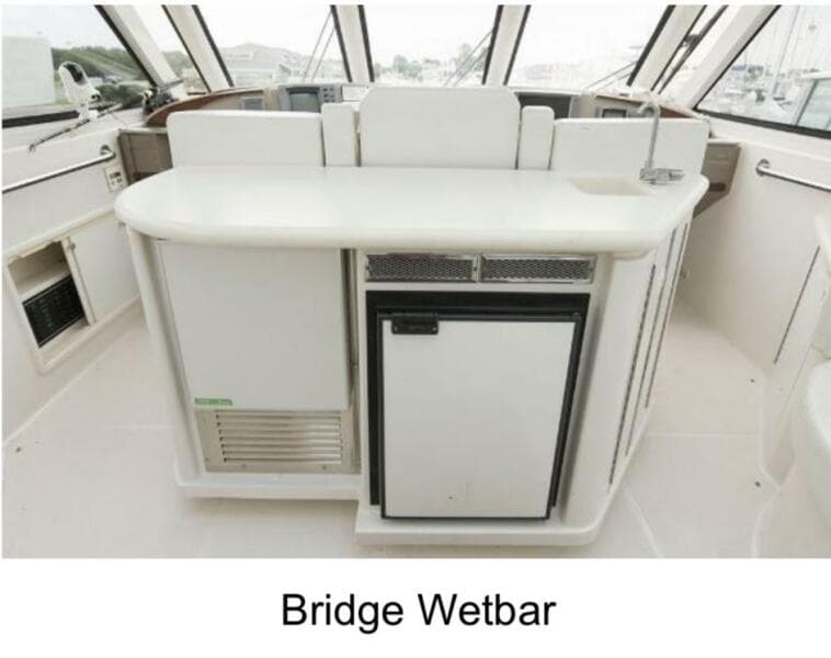 Bridge wet bar on 2000 Carver 506 Motor Yacht, featuring sleek design and modern amenities.