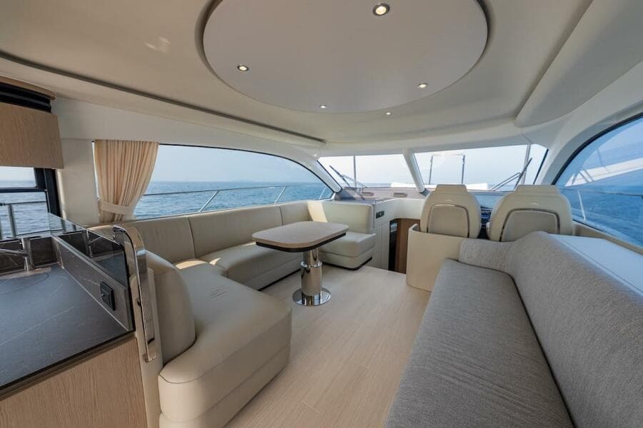 Luxurious interior of 2023 Azimut Fly 53 yacht with elegant seating and ocean view.