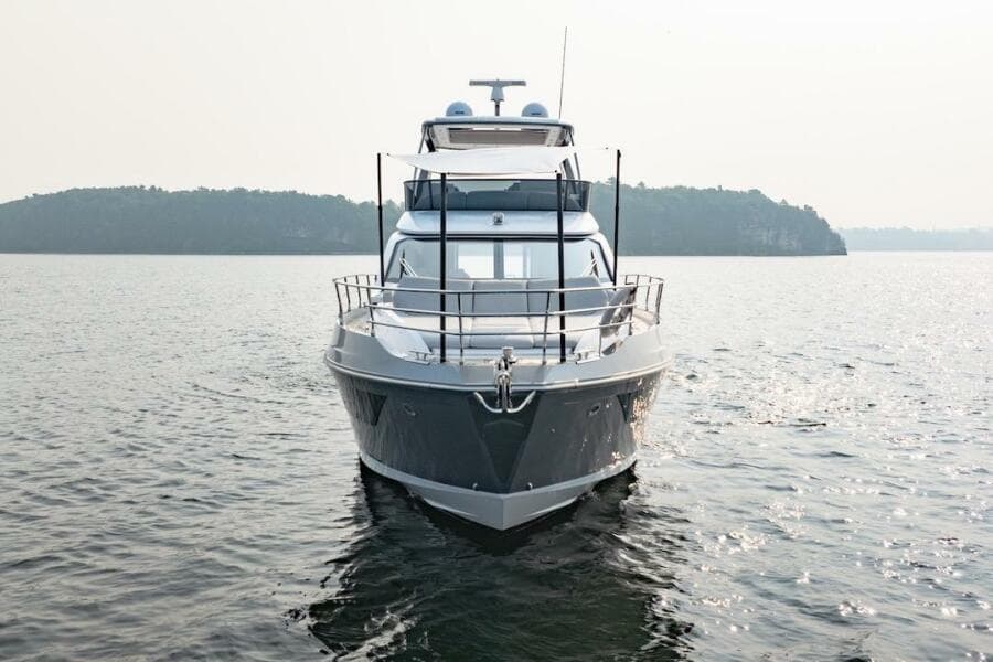 2023 Azimut Fly 53 yacht on calm water with scenic island backdrop.
