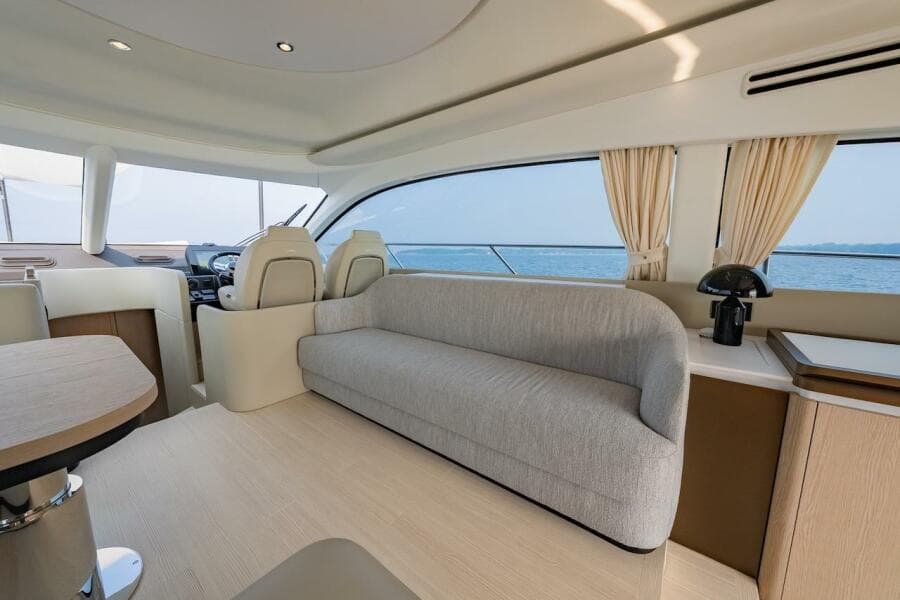Luxurious interior of 2023 Azimut Fly 53 yacht with modern seating and ocean view.