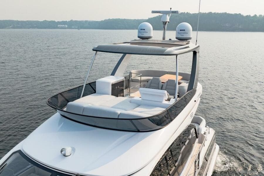 2023 Azimut Fly 53 yacht cruising on a serene lake.