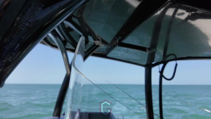 2023 CG Boat Works 35 M-Series on open water, showcasing sleek design and clear skies.