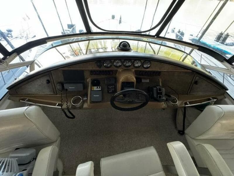 2004 Carver 360 Sport Sedan helm with steering wheel, gauges, and controls.