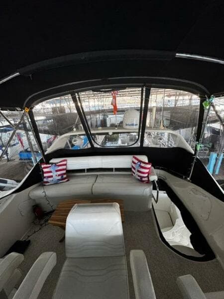 Interior view of 2004 Carver 360 Sport Sedan with seating and striped cushions.