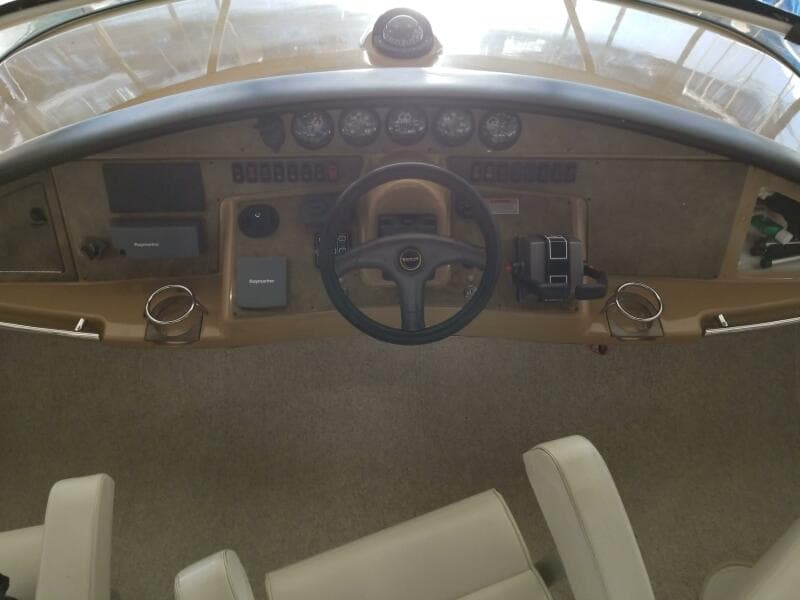 2004 Carver 360 Sport Sedan helm with steering wheel and instrument panel.