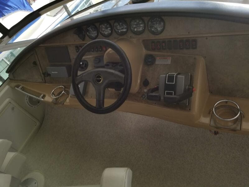 2004 Carver 360 Sport Sedan dashboard with steering wheel and control panel.