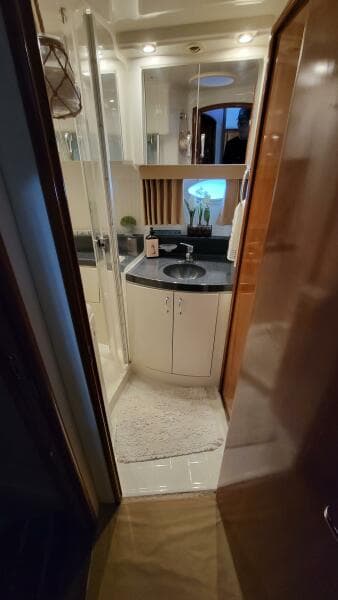 2004 Carver 360 Sport Sedan bathroom with modern fixtures and compact design.