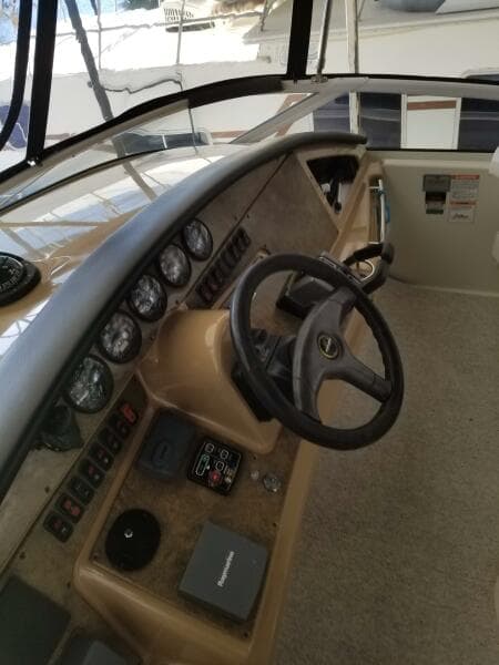 2004 Carver 360 Sport Sedan helm with steering wheel and instrument panel.