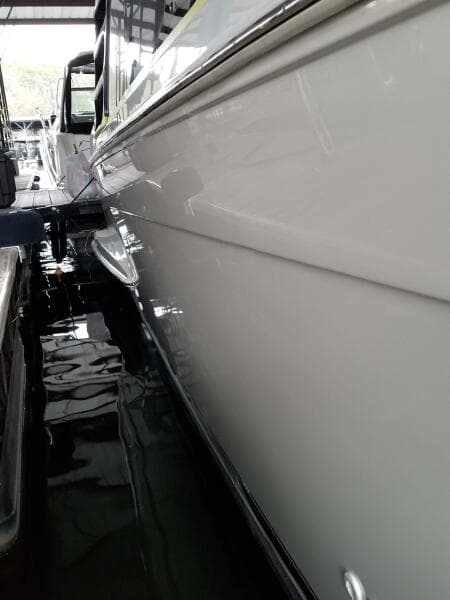 2004 Carver 360 Sport Sedan docked, showcasing sleek white hull design.