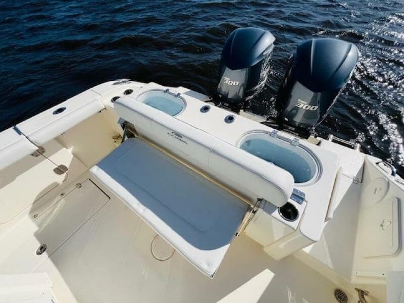 2021 Cobia 301 Center Console boat with twin 300 engines on open water.