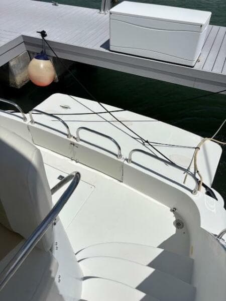 2006 Carver 43 Motor Yacht docked, showing deck and railing details.