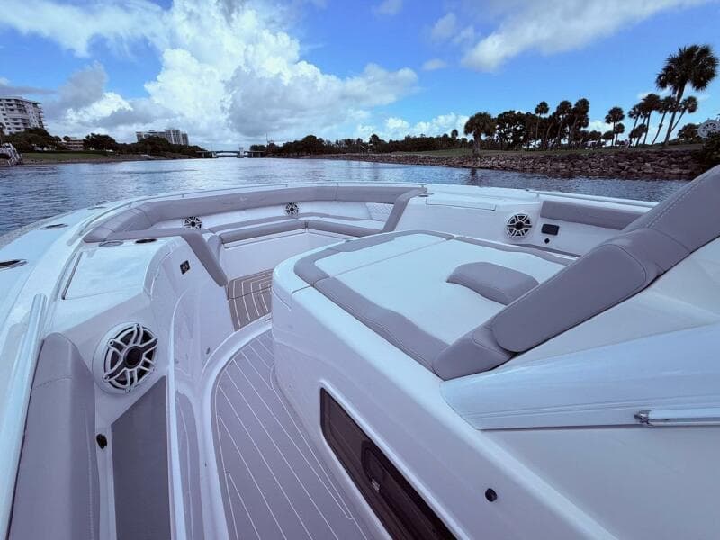 Luxurious 2024 Scout 400 LXF boat interior with plush seating and scenic waterway view.