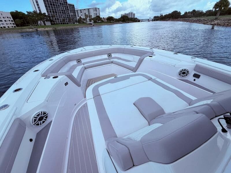 2024 Scout 400 LXF boat interior with luxurious seating on a calm waterway.