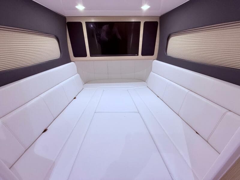 Luxurious interior cabin of 2024 Scout 400 LXF with white seating and modern design.