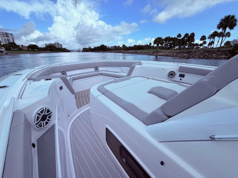 2024 Scout 400 LXF luxury boat interior with plush seating and scenic waterway view.