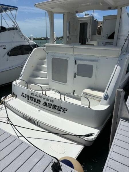 2006 Carver 43 Motor Yacht docked, rear view, named "Liquid Asset," in Marathon, FL.