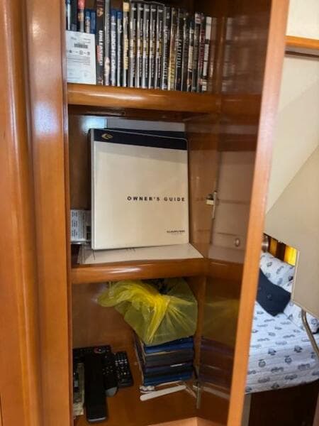 Owner's guide in wooden cabinet on Carver 43 Motor Yacht, 2006 model.