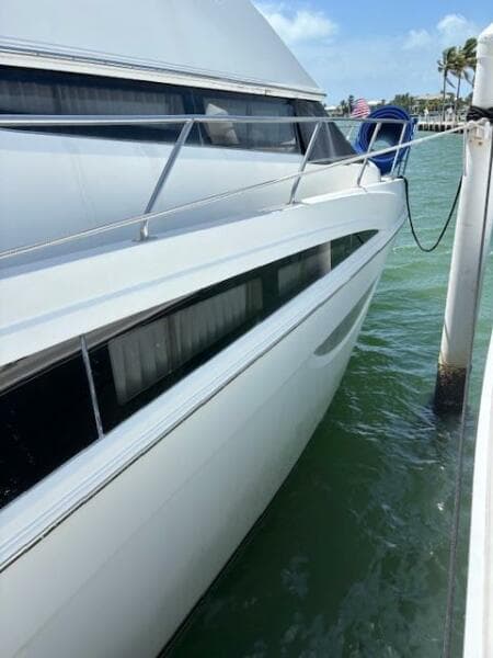 2006 Carver 43 Motor Yacht docked in sunny marina, side view.