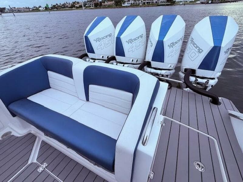 2022 Nor-Tech 390 Sport Center Console with quad Mercury Racing 450 engines, blue and white seating.