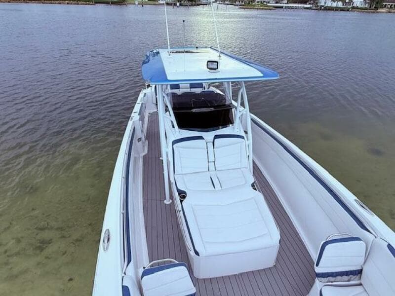2022 Nor-Tech 390 Sport Center Console boat on calm water, featuring spacious seating and sleek design.