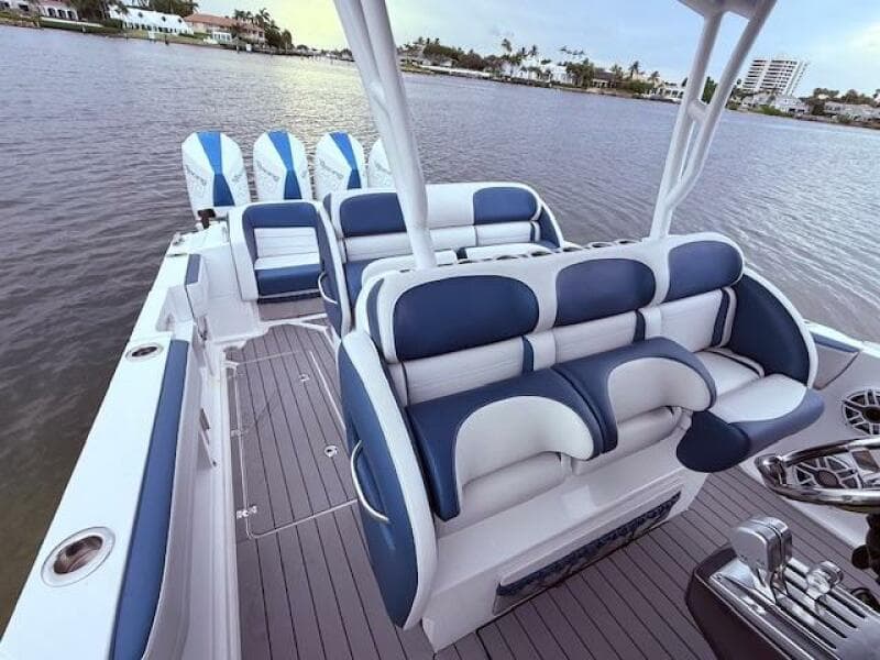 2022 Nor-Tech 390 Sport Center Console boat with luxurious seating on calm water.
