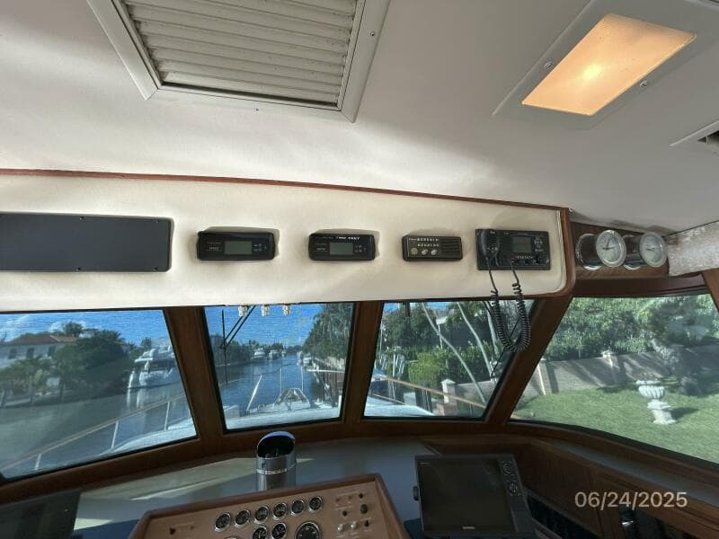 63' Hatteras pilothouse helm overhead electronics