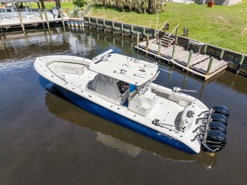 2015 Yellowfin 39 boat with quad Mercury engines docked in a canal.
