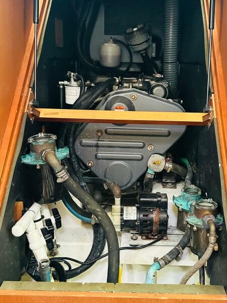 Engine compartment of a 2015 Beneteau Oceanis 45 sailboat, showcasing mechanical components.
