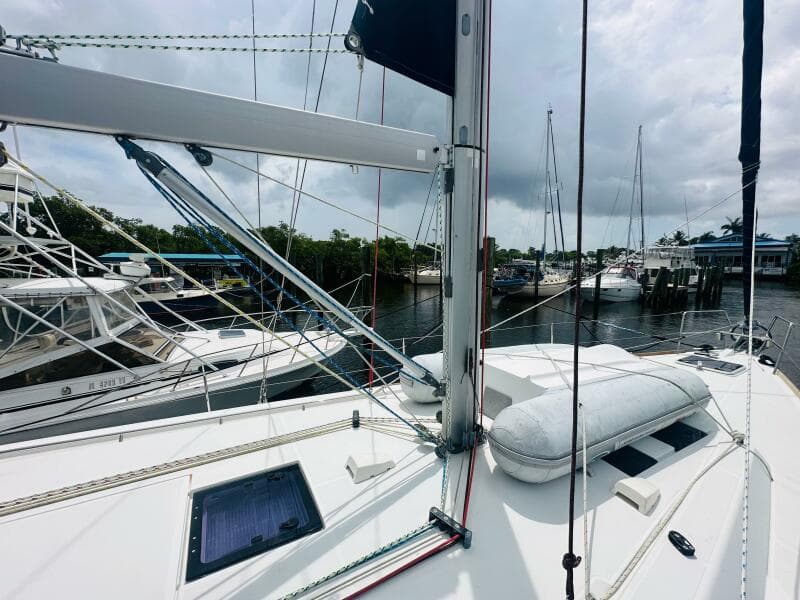 Beneteau Oceanis 45 sailboat deck, 2015 model, docked with other boats in a marina.