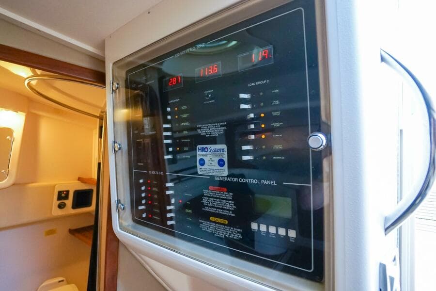 Control panel inside 2007 Grady-White Express 360 boat, featuring various switches and indicators.