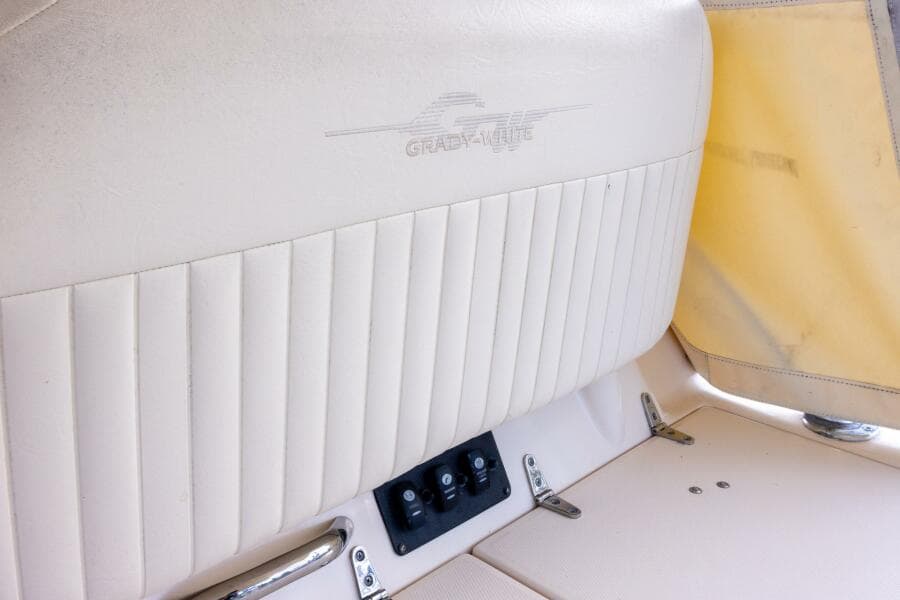 2007 Grady-White Express 360 boat interior with beige seating and control panel.