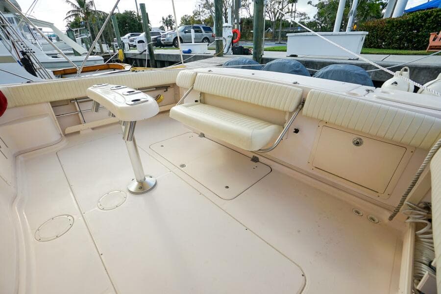 2007 Grady-White Express 360 boat deck with seating and table, docked at marina.