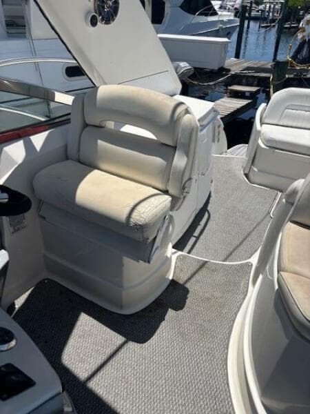 2007 Monterey 350 Sport Yacht interior with cushioned seating and carpeted flooring.
