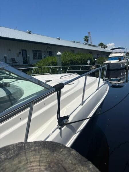 2007 Monterey 350 Sport Yacht docked at marina under clear blue sky.