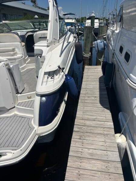2007 Monterey 350 Sport Yacht docked beside wooden pier in marina.