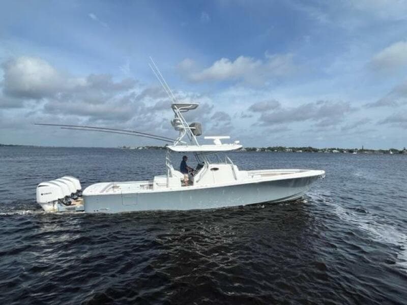 2018 Regulator 41 boat cruising on open water under cloudy skies.