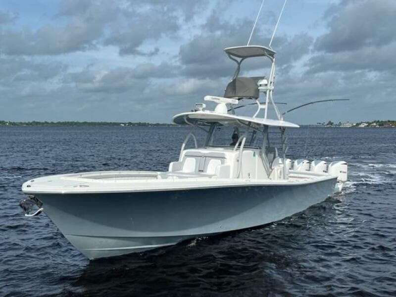 2018 Regulator 41 boat cruising on open water under cloudy skies.