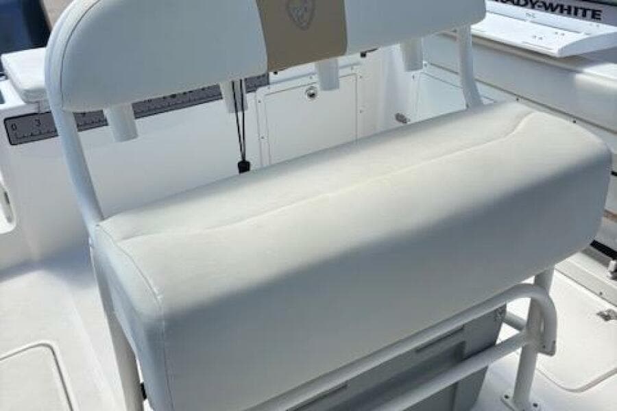2018 Century 2600 Center Console boat seat, white upholstery, sturdy design.