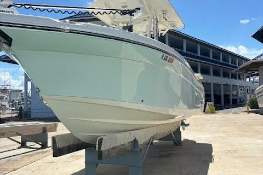 2018 Century 2600 Center Console boat on display at a marina.