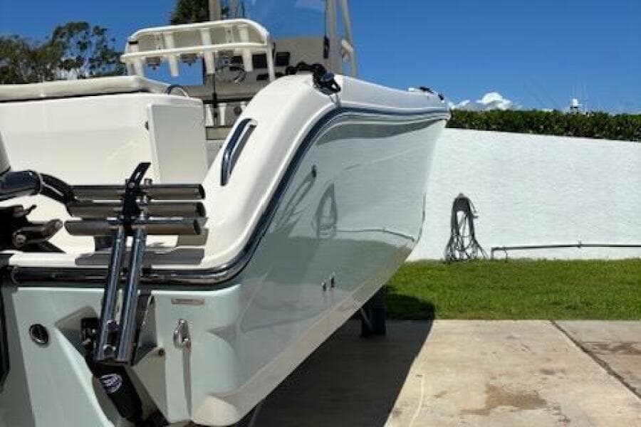 2018 Century 2600 Center Console boat on a driveway, sunny day.