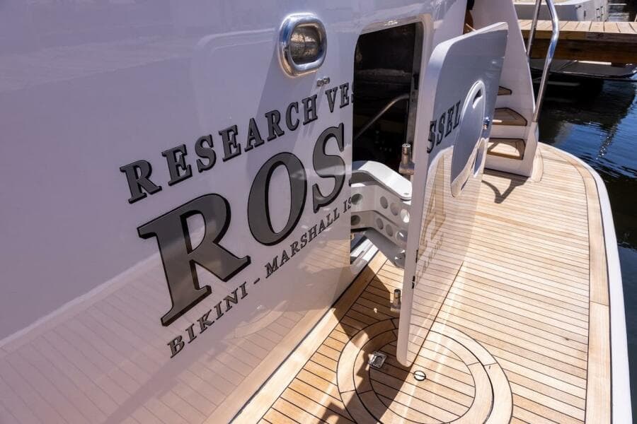Research vessel docked, featuring "ROS" and "Bikini - Marshall Islands" on the hull.