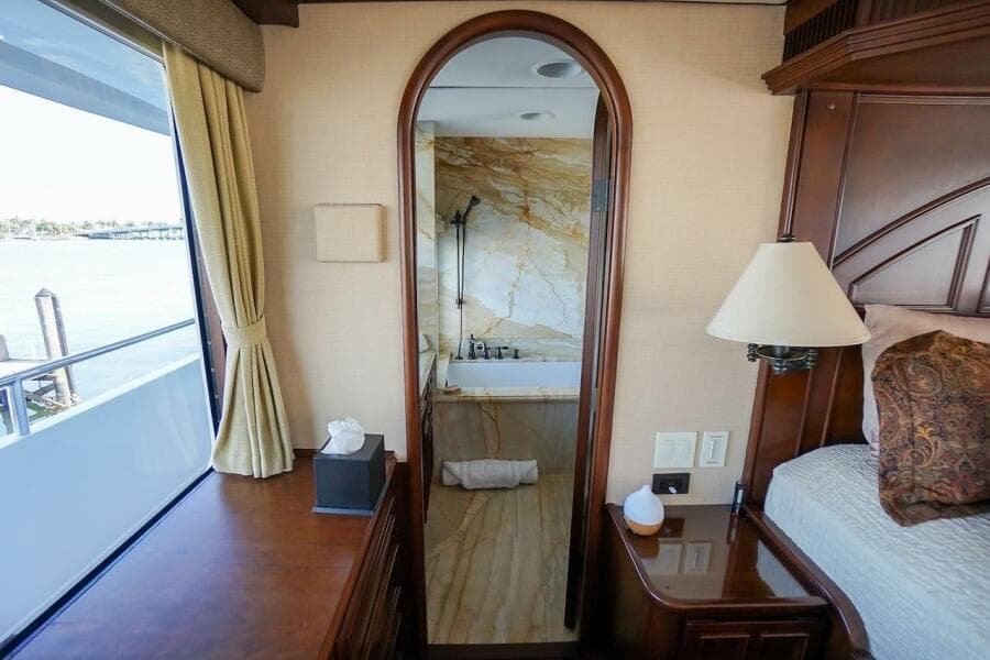 Luxurious 1996 ABD 90 Explorer yacht interior with elegant bedroom and marble bathroom.