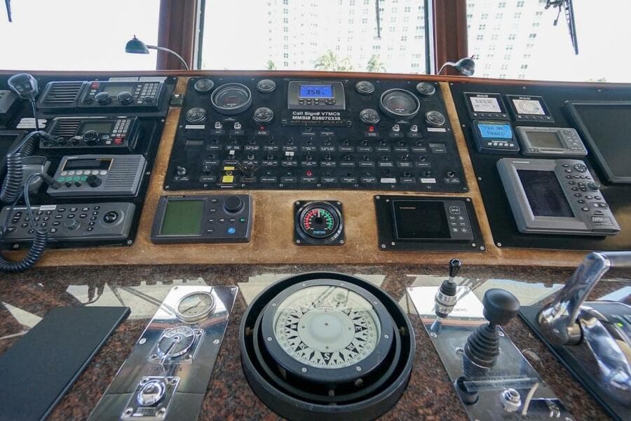 Luxurious 1996 ABD 90 Explorer yacht interior with map and globe decor.