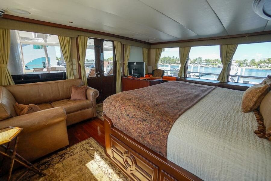 Luxurious 1996 ABD 90 Explorer yacht interior with elegant bedroom and scenic window views.