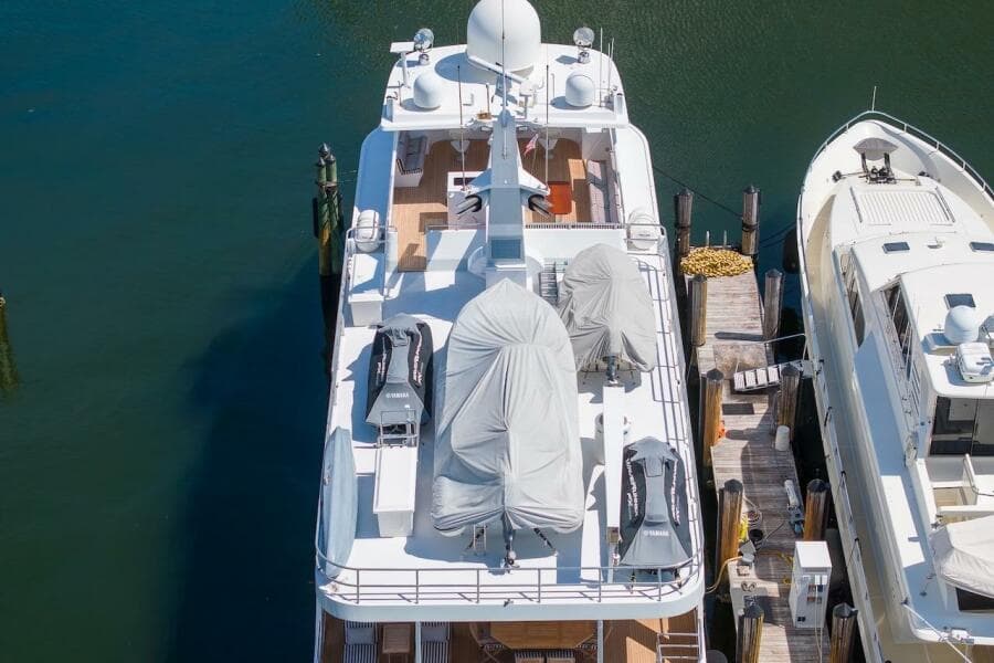 Aerial view of 1996 ABD 90 Explorer yacht docked beside another vessel.